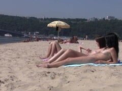 Shy teen pops her top off for all the beach goers Thumb