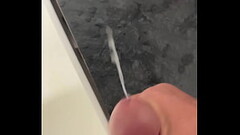 Huge cumshot at work jacking my cock in the bathroom at work Thumb