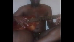 Lay major a.k.a llamasr wearing a banana mask on top of face for cosmetic therapy while freestyle playing a guitar for free and for fun Thumb