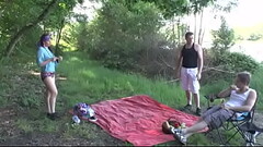 Dirty brunette gets double teamed with a carrot outdoor in a public place Thumb