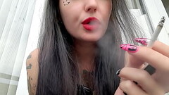 Smoking fetish from Dominatrix Nika. The Dominatrix smokes sexy and blows smoke in your face. Thumb