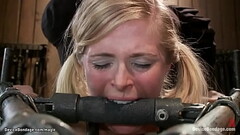 Busty blonde in metal device ass fucked Thumb