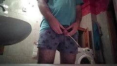 Naughty guy pees in the bathroom and then jerks his uncut dick! Thumb