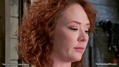 Redhead slave tied up to X frame Thumb