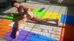An attractive lady is sunbathing on the roof of her house. Nude yoga TEASER 1 Thumb