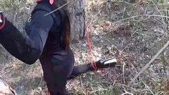 Tied to a tree on a sexy outfit, masked and outdoor deepthroat with no mercy Thumb