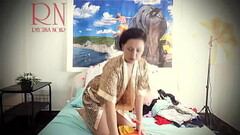 Housewife laid out sexy lingerie and outfits on the bed. She tries on panties, corsets, bras, socks, stockings, tights, peignoir. 1 Thumb