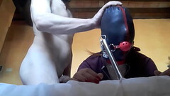 Tied to a machine, masked and hooded, she has to suck a big cock Thumb